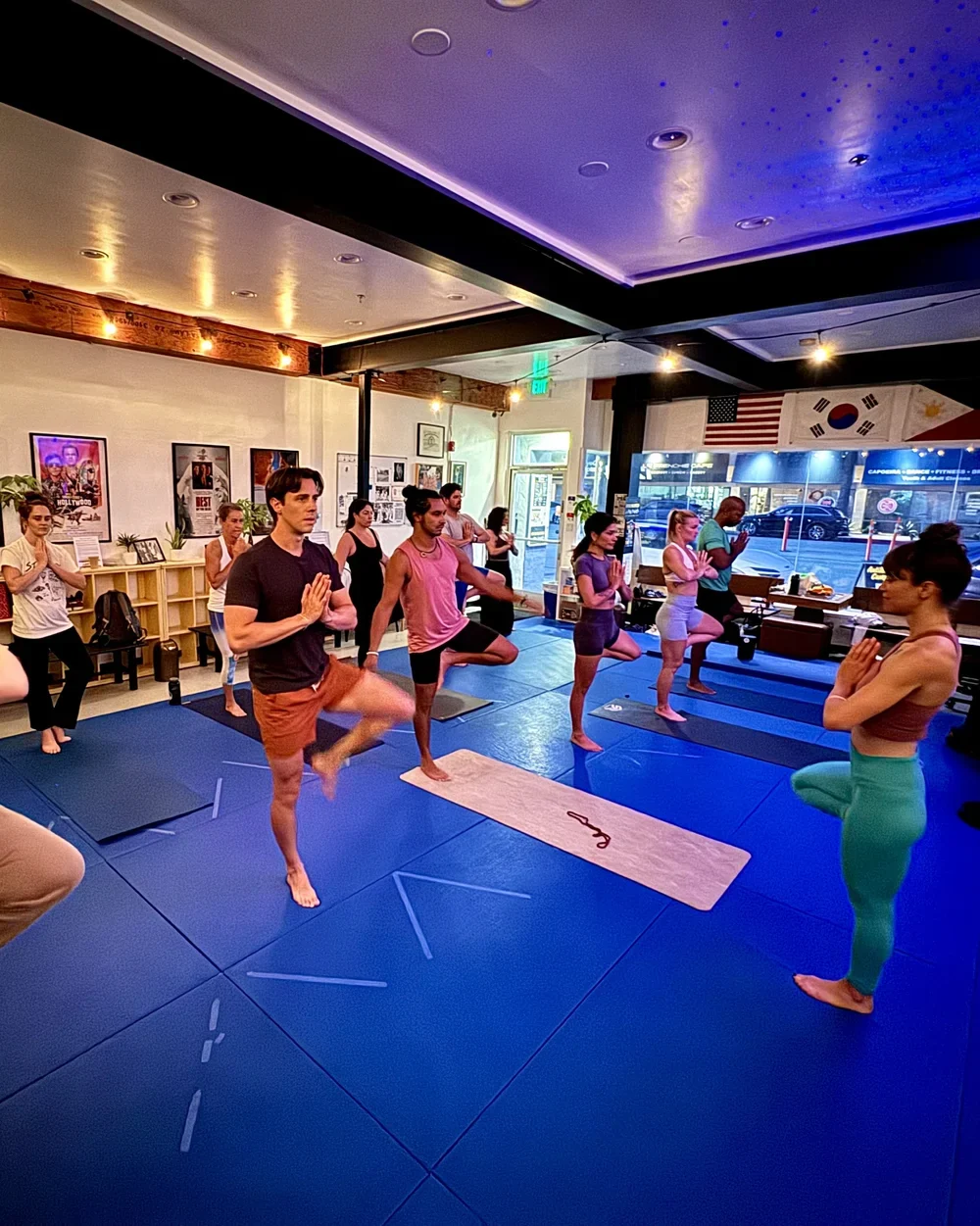A group practicing Envision Yoga in a fitness studio